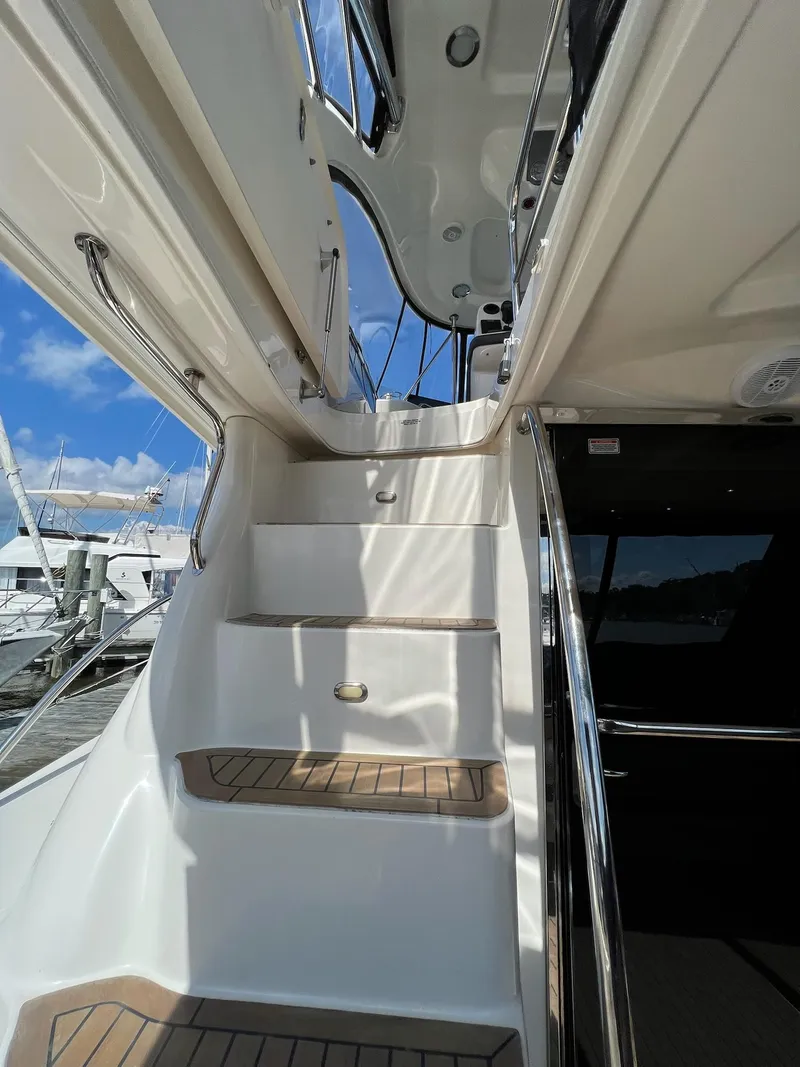 Slide: The Image of Staircase on 2005 Sea Ray 500 Sedan Bridge yacht, leading to upper deck. - 25