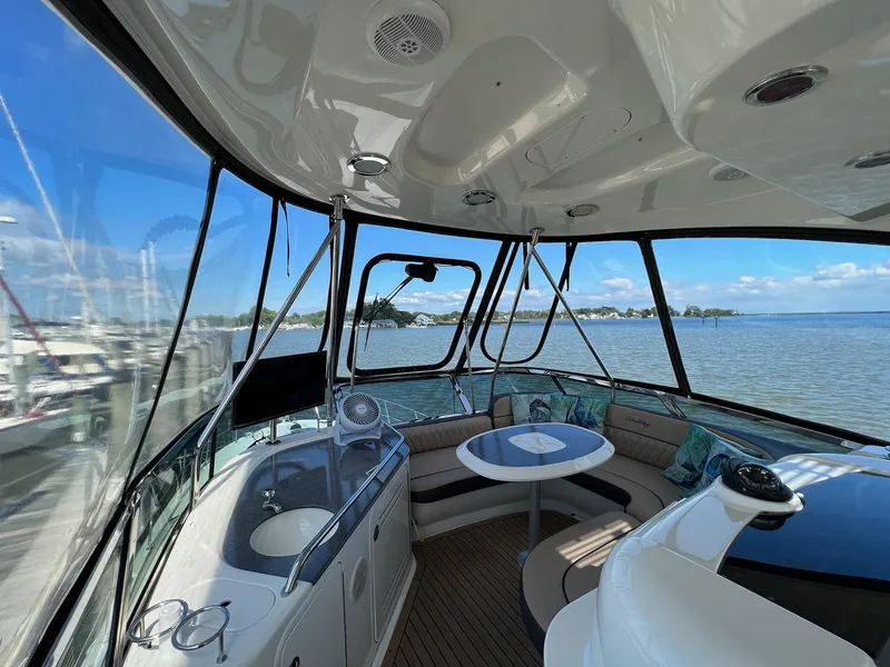 Slide: The Image of Interior view of 2005 Sea Ray 500 Sedan Bridge yacht with seating and navigation equipment. - 26