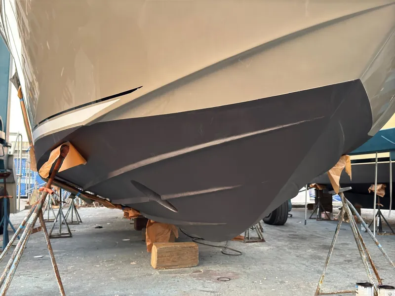 Slide: The Image of 2005 Sea Ray 500 Sedan Bridge boat hull on dry dock for maintenance. - 3