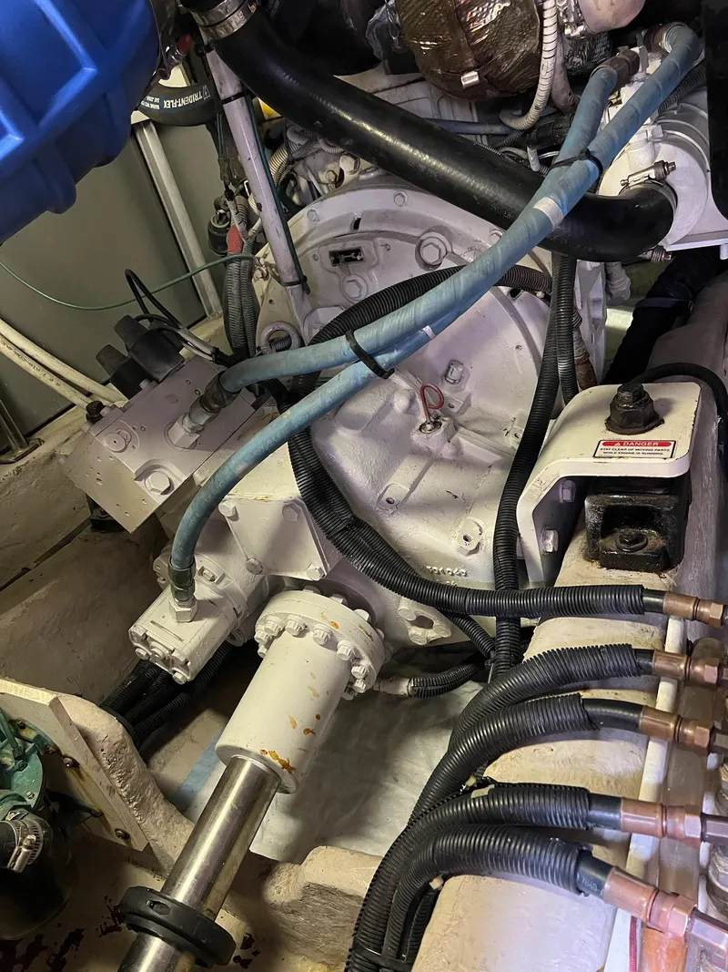 Slide: The Image of Engine room of 2005 Sea Ray 500 Sedan Bridge with visible mechanical components and wiring. - 35