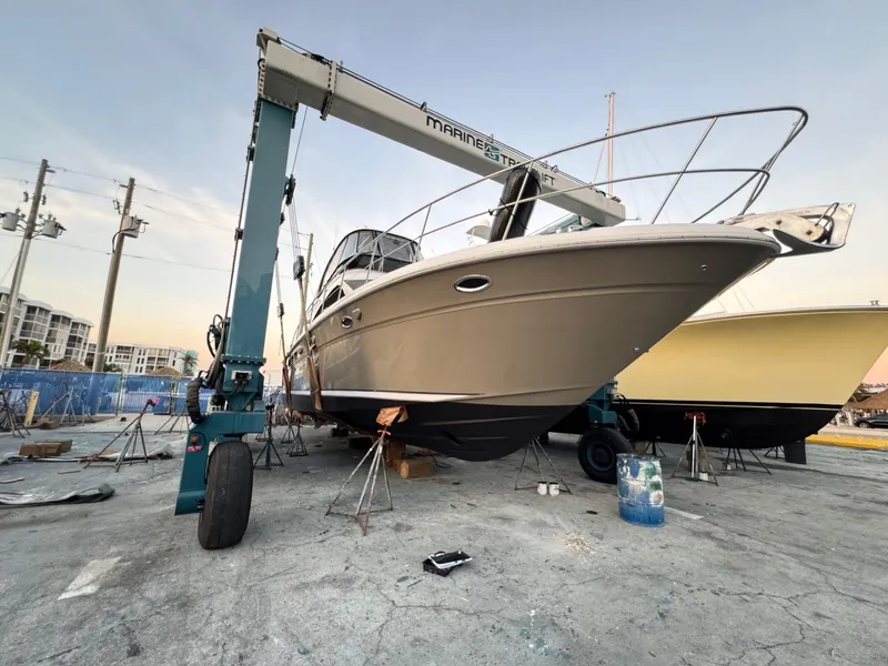 Slide: The Image of 2005 Sea Ray 500 Sedan Bridge yacht on dry dock with crane. - 5