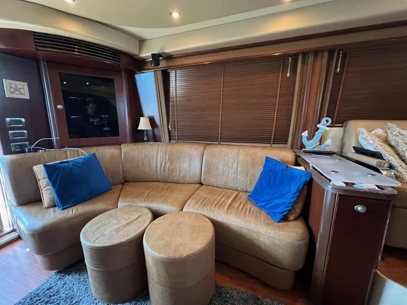 Slide: The Image of Luxurious interior of 2005 Sea Ray 500 Sedan Bridge with leather seating and nautical decor. - 7
