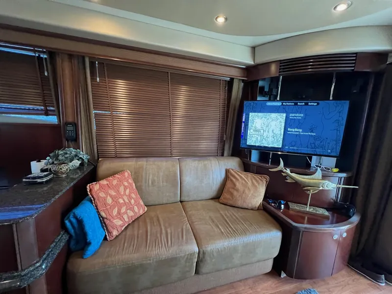 Slide: The Image of Luxurious interior of 2005 Sea Ray 500 Sedan Bridge with cozy seating and modern amenities. - 8