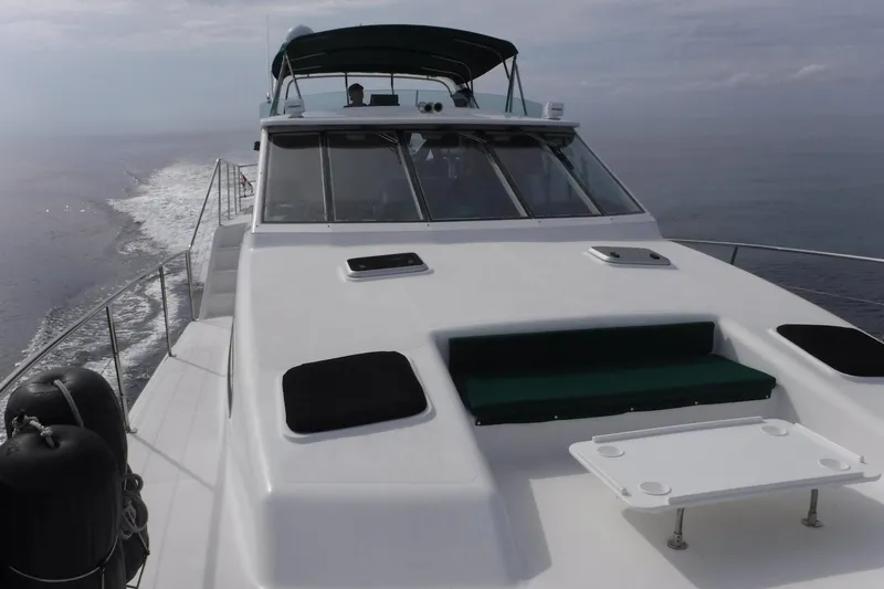 Slide: The Image of 2002 Wright Catamaran C50 Pilot House Power Catamaran cruising on open water. - 16