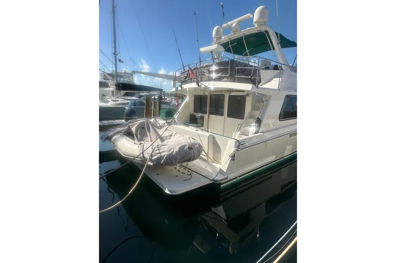 Slide: The Image of 2002 Wright Catamaran C50 Pilot House Power Catamaran docked in marina, rear view. - 18