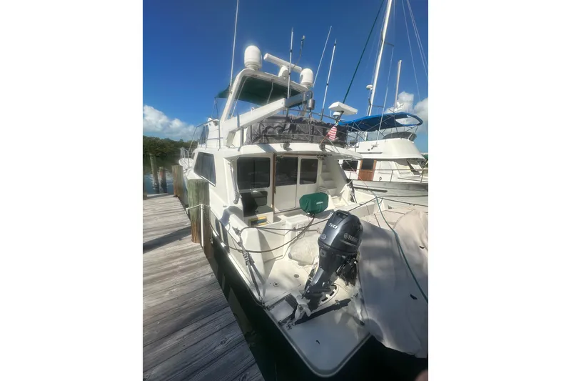 Slide: The Image of 2002 Wright Catamaran C50 Pilot House Power Catamaran docked under clear blue sky. - 19