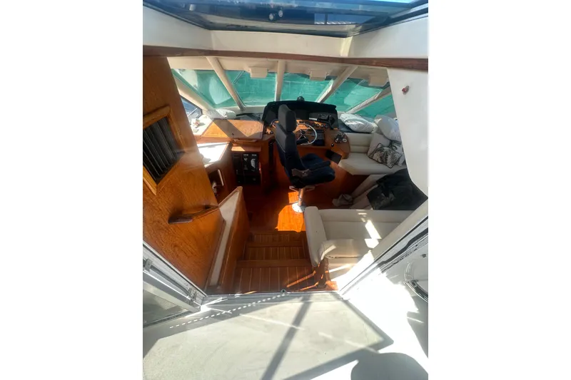 Slide: The Image of 2002 Wright Catamaran C50 Pilot House interior with helm, seating, and wooden finishes. - 27