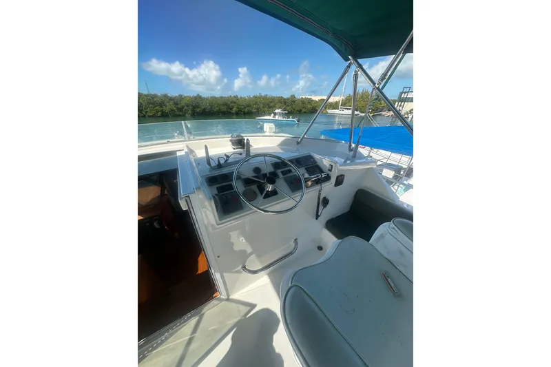 Slide: The Image of 2002 Wright Catamaran C50 Pilot House Power Catamaran helm with scenic water view. - 29