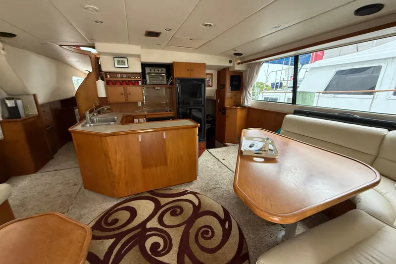 Slide: The Image of Luxurious interior of 2001 Wright Catamaran C50 Pilot house with kitchen and dining area. - 38