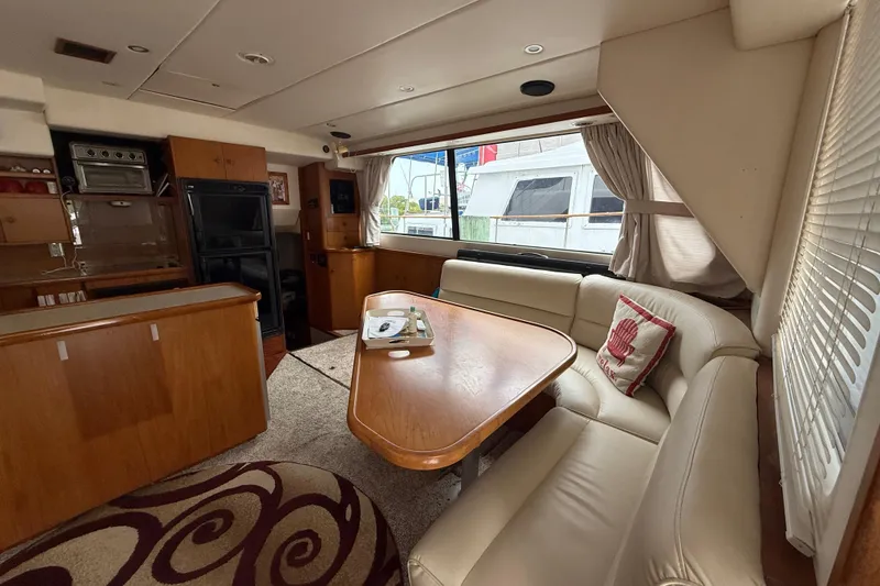 Slide: The Image of Luxurious interior of 2001 Wright Catamaran C50 Pilot house with elegant seating and dining area. - 39