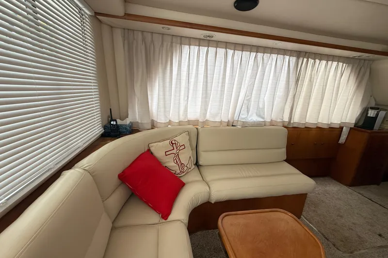 Slide: The Image of Cozy interior of 2001 Wright Catamaran C50 Pilot house with cream seating and nautical decor. - 40
