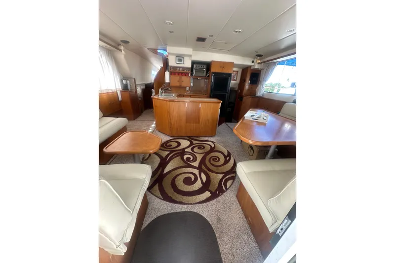 Slide: The Image of Luxurious interior of 2002 Wright Catamaran C50 Pilot House, featuring elegant wood finishes. - 7