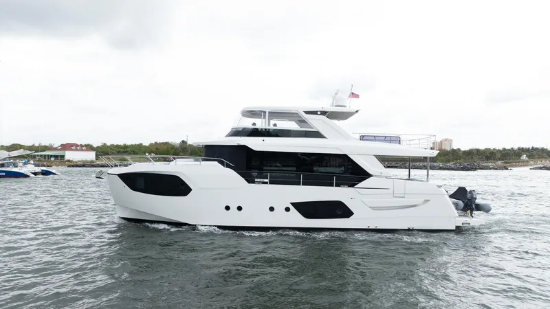 The Image of 2024 Absolute 68 NAVETTA yacht cruising on open water, showcasing sleek design and modern features. - 0