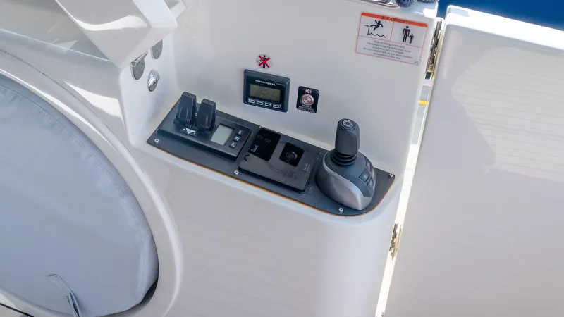 Slide: The Image of Control panel of 2024 Absolute 68 NAVETTA yacht, featuring joystick and digital displays. - 13