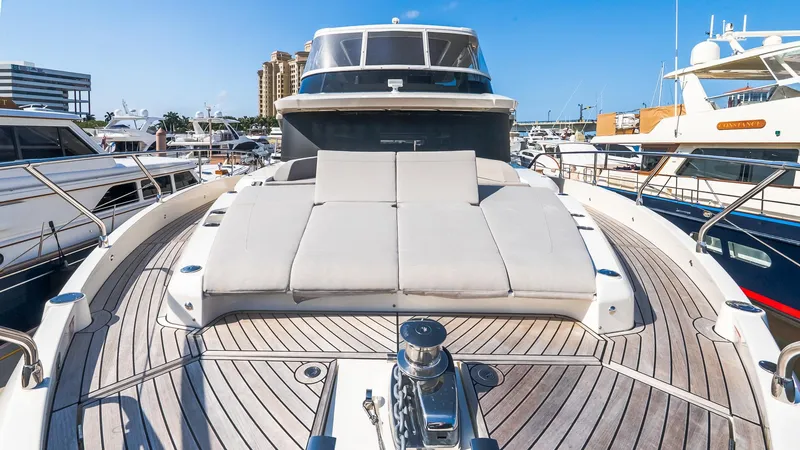 Slide: The Image of 2024 Absolute 68 NAVETTA yacht with spacious deck and luxurious sunbathing area. - 16