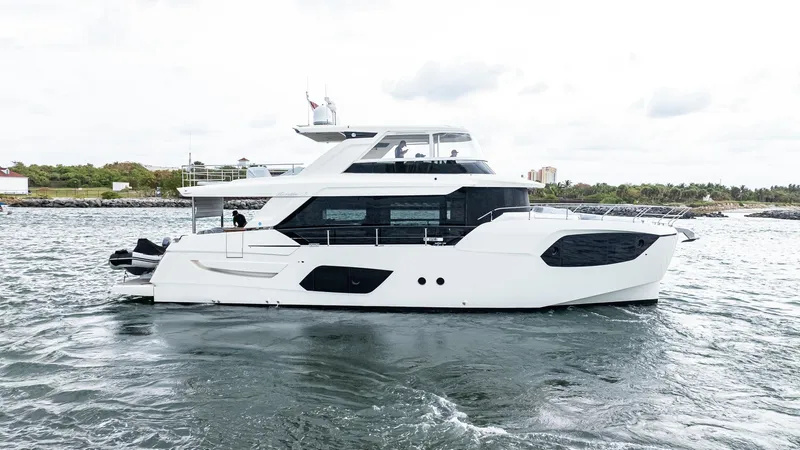 Slide: The Image of 2024 Absolute 68 NAVETTA yacht cruising on open water, showcasing sleek design and modern features. - 2
