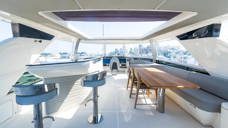 Slide: The Image of Luxurious interior of 2024 Absolute 68 NAVETTA yacht with modern seating and panoramic views. - 22