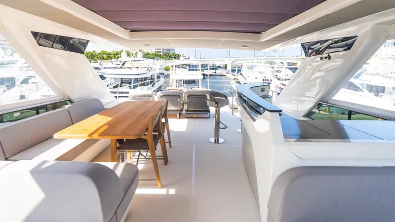 Slide: The Image of Luxurious interior of 2024 Absolute 68 NAVETTA yacht with elegant seating and dining area. - 24