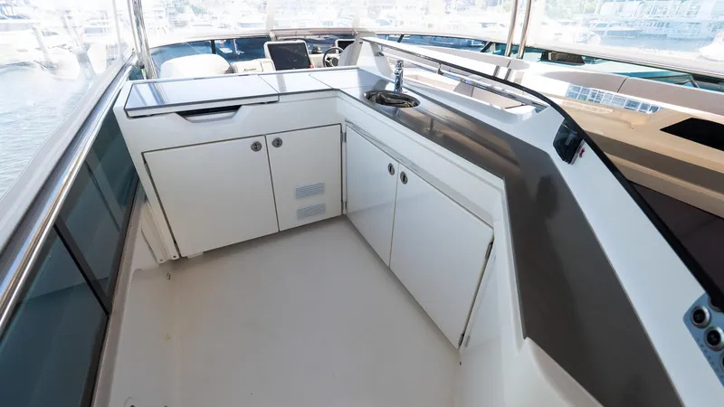 Slide: The Image of 2024 Absolute 68 NAVETTA yacht interior with sleek cabinetry and modern design. - 25