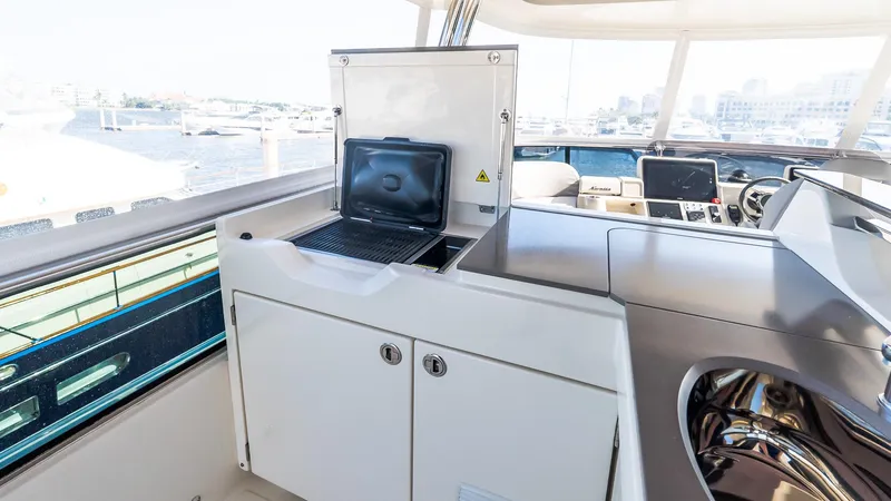 Slide: The Image of 2024 Absolute 68 NAVETTA yacht interior with modern navigation equipment and sleek design. - 27