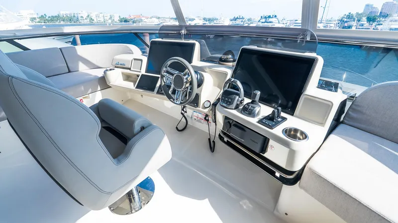 Slide: The Image of 2024 Absolute 68 NAVETTA yacht helm with modern controls and seating. - 28