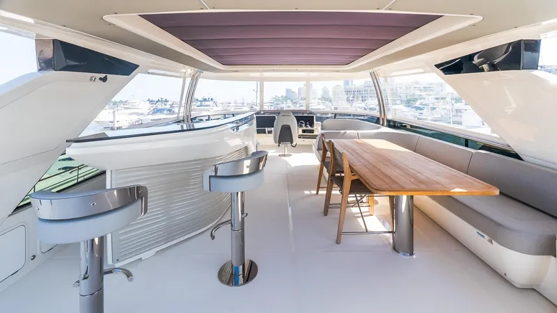 Slide: The Image of Luxurious interior of 2024 Absolute 68 NAVETTA yacht with modern seating and dining area. - 33