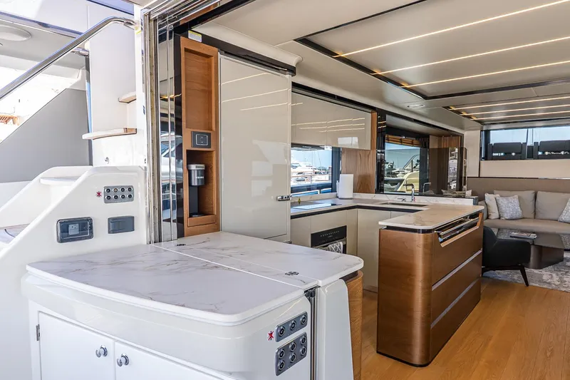 Slide: The Image of Luxurious interior of 2024 Absolute Navetta 68 yacht with modern kitchen and seating area. - 36