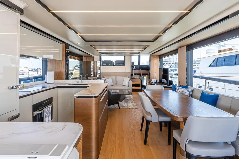 Slide: The Image of Luxurious interior of 2024 Absolute Navetta 68 yacht with modern kitchen and dining area. - 37