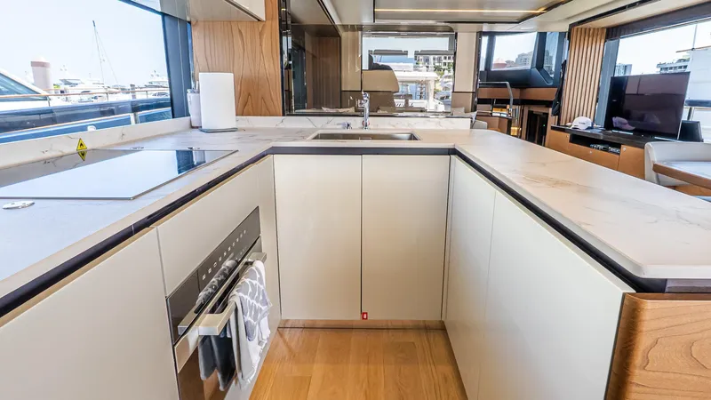 Slide: The Image of Modern kitchen interior on 2024 Absolute 68 NAVETTA yacht, featuring sleek countertops and appliances. - 41