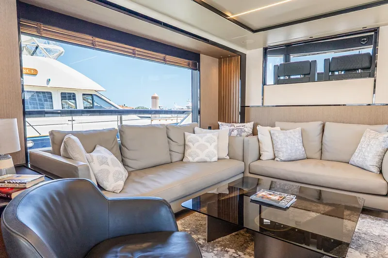 Slide: The Image of Luxurious interior of 2024 Absolute Navetta 68 yacht with elegant seating and large windows. - 46