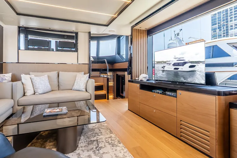 Slide: The Image of Luxurious interior of 2024 Absolute Navetta 68 yacht with modern furnishings and large windows. - 48