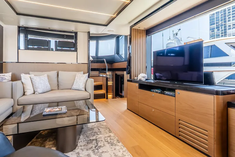 Slide: The Image of Luxurious interior of 2024 Absolute Navetta 68 yacht with modern furnishings and large TV. - 49