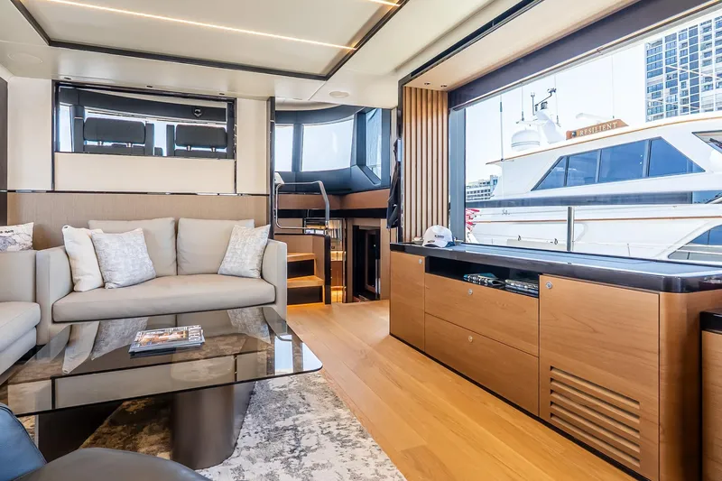 Slide: The Image of Luxurious interior of 2024 Absolute Navetta 68 yacht with modern furnishings and large windows. - 50