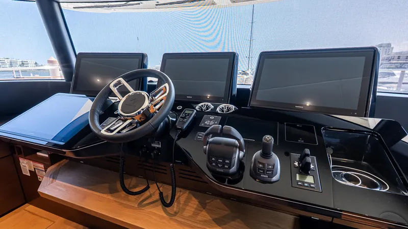 Slide: The Image of Helm of 2024 Absolute 68 NAVETTA yacht with advanced navigation controls and displays. - 55