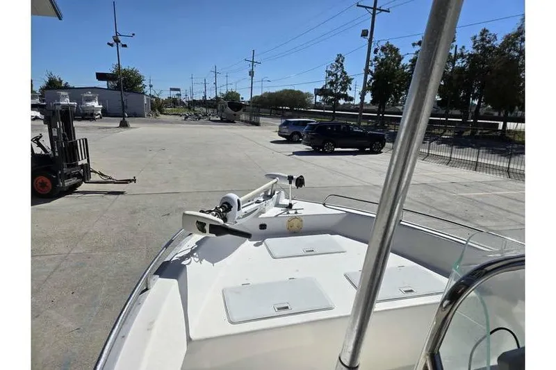 Slide: The Image of 2002 Cape Horn 17 boat parked in a lot, with visible bow and equipment. - 2