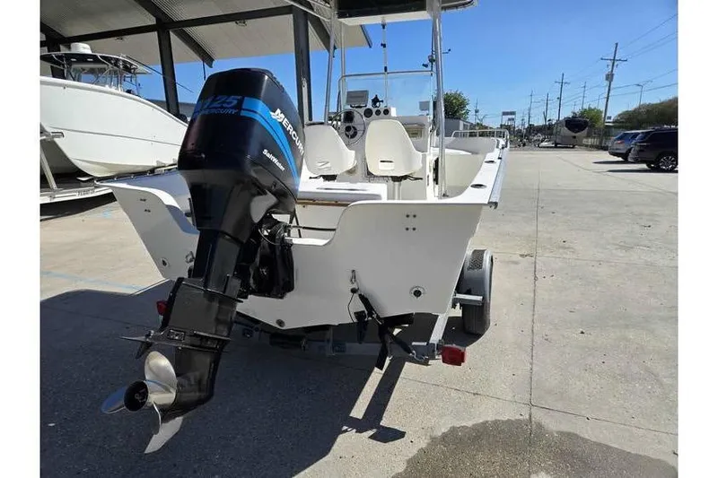 Slide: The Image of 2002 Cape Horn 17 boat with Mercury 125 outboard motor on trailer. - 5