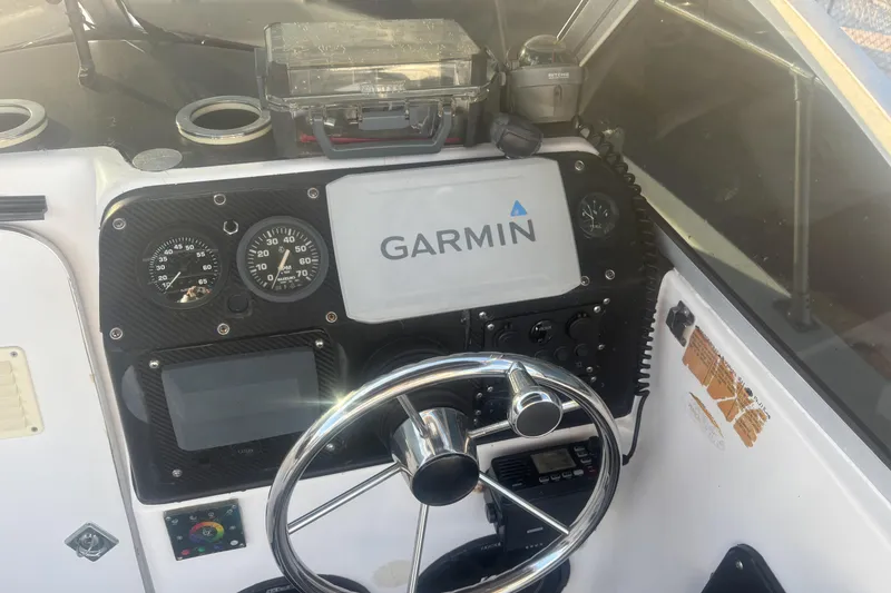 Slide: The Image of Dashboard of a 1998 Bayliner Trophy Walkaround with Garmin navigation system. - 10