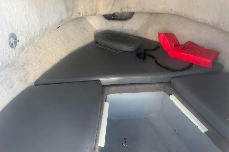Slide: The Image of Interior cabin of 1998 Bayliner Trophy Walkaround with cushions and red life jacket. - 15
