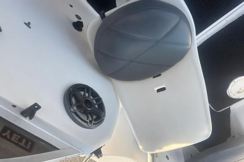Slide: The Image of Bayliner 2002 Trophy Walkaround 1998 interior with speaker and seat detail. - 16