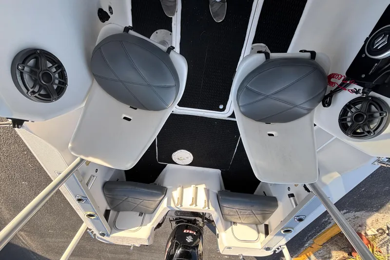 Slide: The Image of Interior view of 1998 Bayliner Trophy Walkaround boat with seating and speakers. - 17