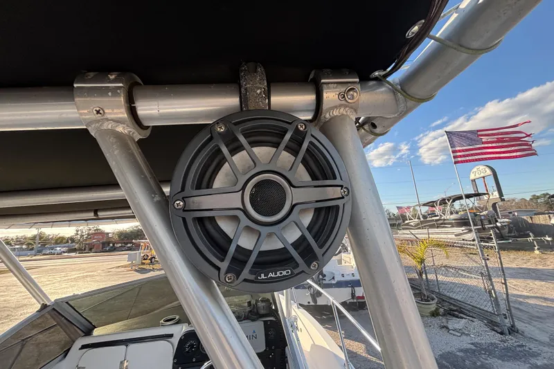 Slide: The Image of Speaker mounted on a 1998 Bayliner Trophy Walkaround boat, with American flag in background. - 20
