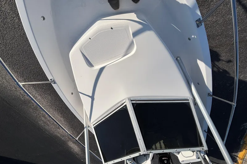 Slide: The Image of 1998 Bayliner Trophy Walkaround boat deck with railing and hatch, viewed from above. - 24