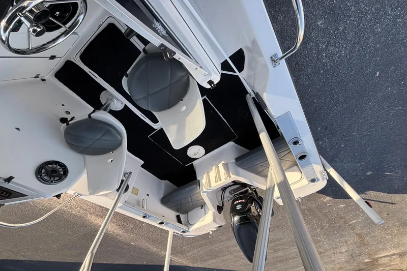 Slide: The Image of 1998 Bayliner Trophy Walkaround boat interior with seating and steering wheel. - 27