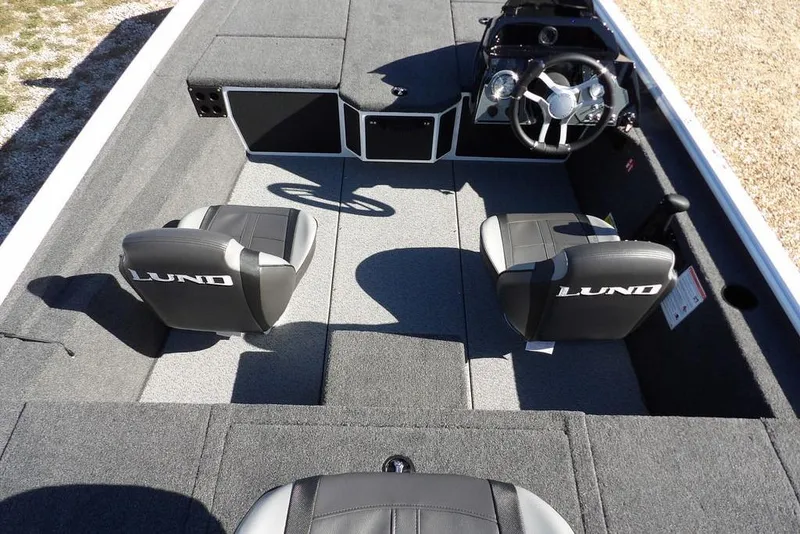 Slide: The Image of 2026 Lund 1875 Renegade boat interior with two seats and steering console. - 16