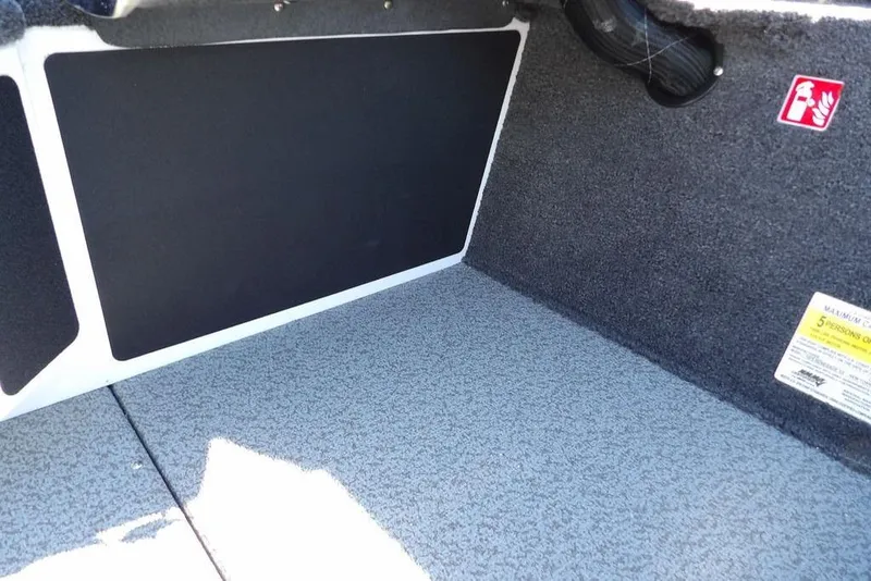 Slide: The Image of Interior view of 2026 Lund 1875 Renegade boat storage compartment. - 26