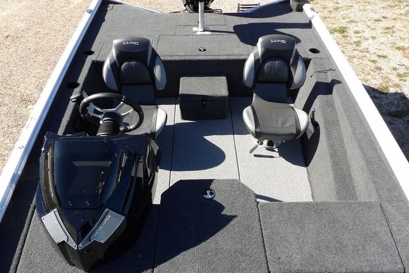 Slide: The Image of 2026 Lund 1875 Renegade boat interior with dual seats and steering console. - 27