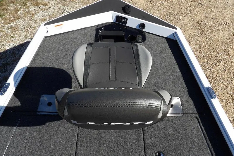 Slide: The Image of 2026 Lund 1875 Renegade boat interior with gray seating and carpeted deck. - 34