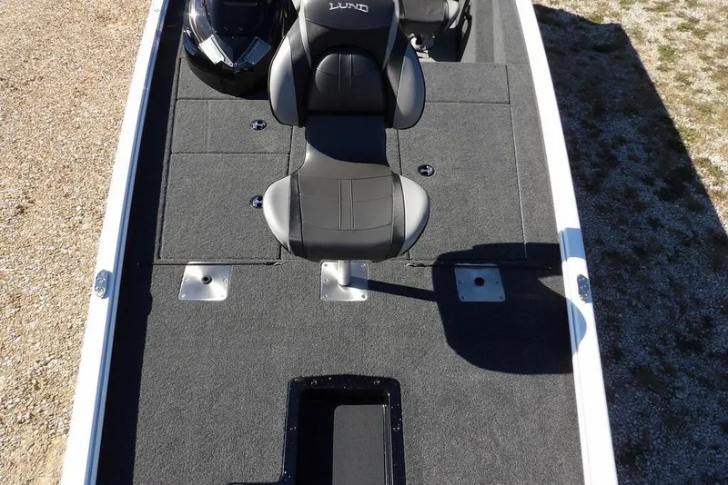 Slide: The Image of 2026 Lund 1875 Renegade boat interior with gray seating and carpeted deck. - 39