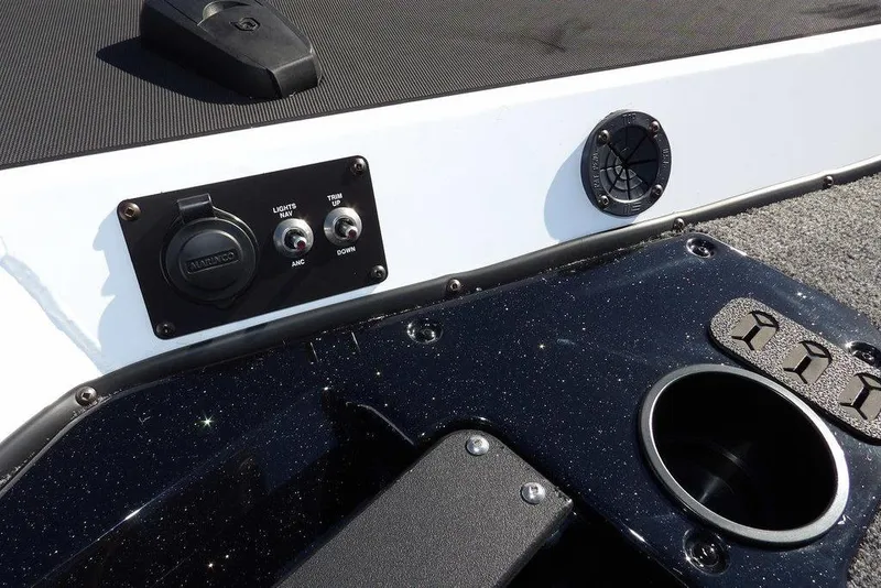 Slide: The Image of 2026 Lund 1875 Renegade boat dashboard with controls and cup holder. - 41