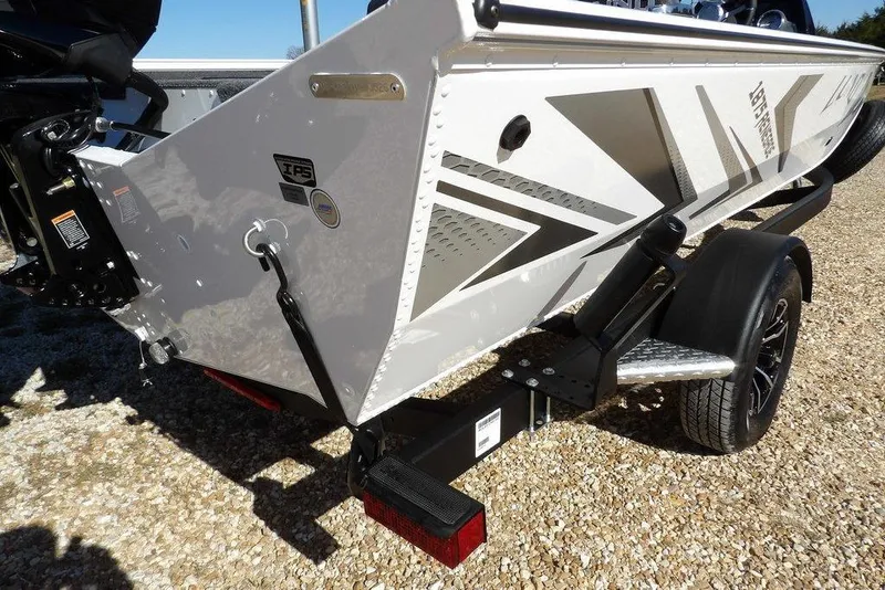 Slide: The Image of 2026 Lund 1875 Renegade boat on trailer, featuring sleek design and modern graphics. - 43